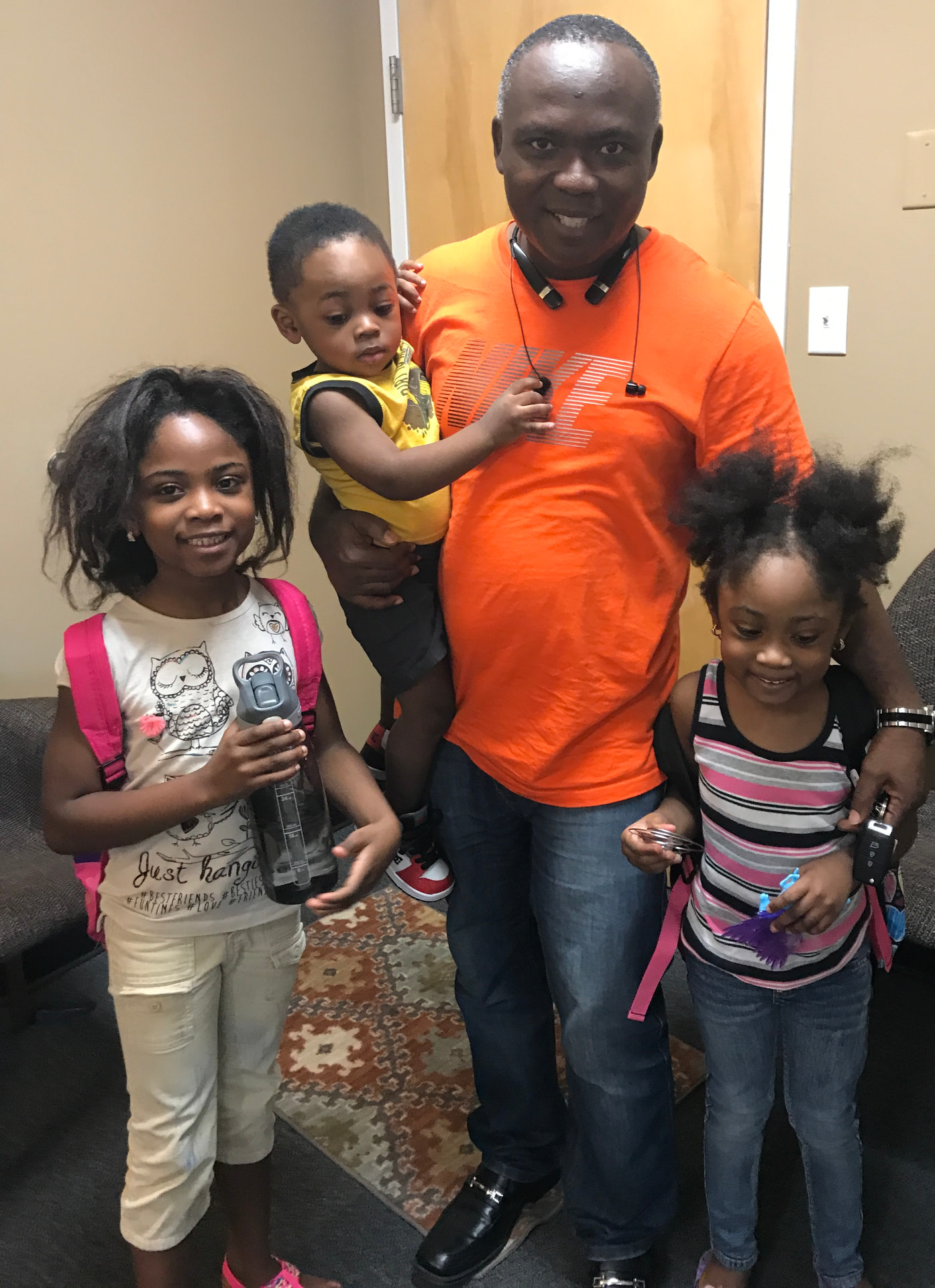 A father with his children, ready for the school year