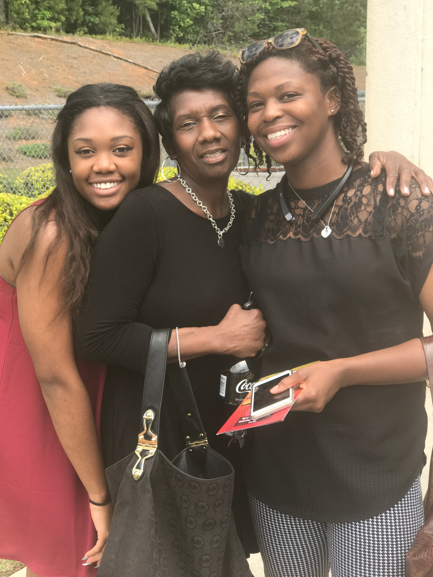 Three women smiling together at a Connections FRC gathering